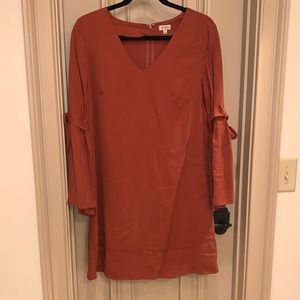 Cremieux bell sleeve dress in rust.